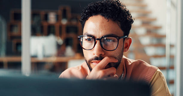 istock Creative, man or thinking in office with tech for digital marketing idea, campaign trend or planning. Person, reading or brainstorming with computer for social media advertising, project or strategy. 2255224546
