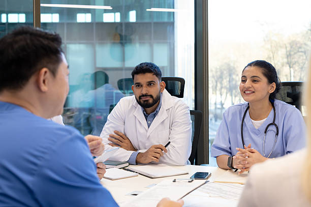 istock Medical professionals collaborating during a team meeting in a modern hospital setting 2255225040