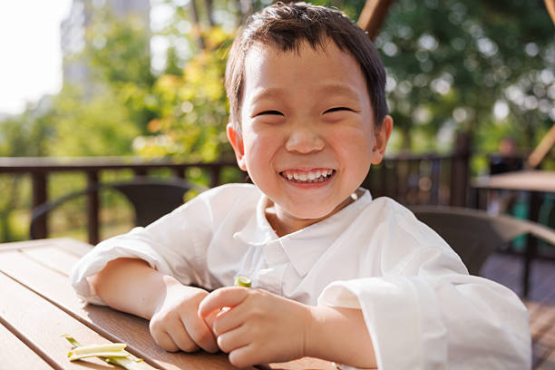 Happy Asian boy smiling at the camera