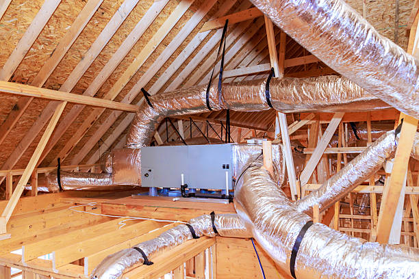 istock Ductwork installation in new home attic during construction phase 2255234688
