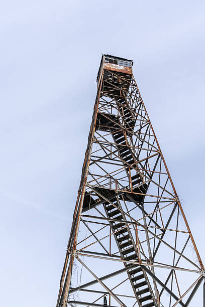 Old abandoned fire tower overcast skies fire prevention concept