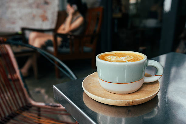 istock Cup of latte with coffee shop view background. 2255241276