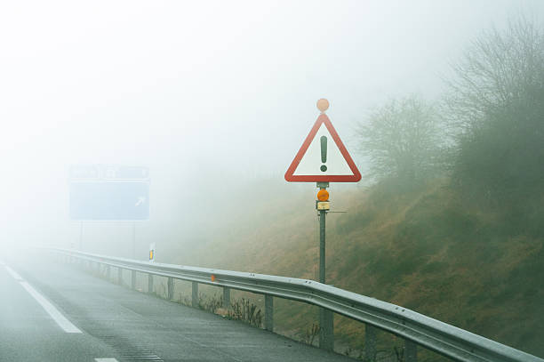 A road sign on the side of the road indicating that there is a petrol station, telephone and freeway toilet nearby.