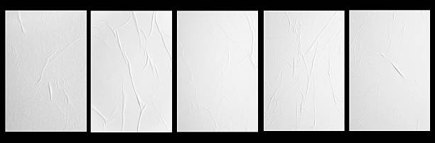 istock five white posters with folds isolated on a black background 2255254951