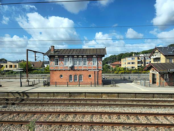 Little danish station building. Captured on a cloudy day in summer season.