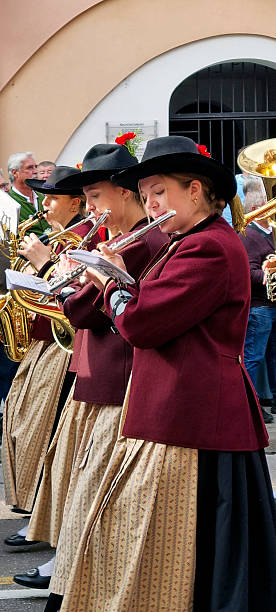 Meran, South Tyrol, Italy: 19 October 2025 - During autumn is held the grape festival in Merano, Sudtirol. Many groups from villages nearby come to celebrate. They march in groups with a marching band.