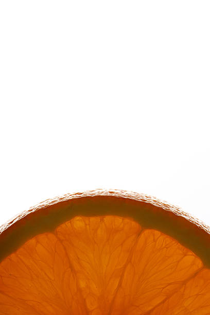 Sliced orange on a white background. The image highlights the vibrant orange peel and juicy interior, with segments and pulp visible. The smooth, textured surface of the peel contrasts with the glossy, translucent flesh inside. The composition creates a harmonious blend of color and texture, emphasizing the fruit's natural beauty.