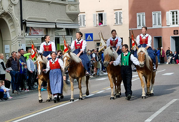Meran, South Tyrol, Italy: 19 October 2025 - During autumn is held the grape festival in Merano, Sudtirol. Many groups from villages nearby come to celebrate. They march in groups with a marching band.