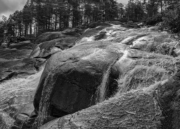 A vertical view of the Skrelia waterfall and hiking area near Lyngdal in southern Norway