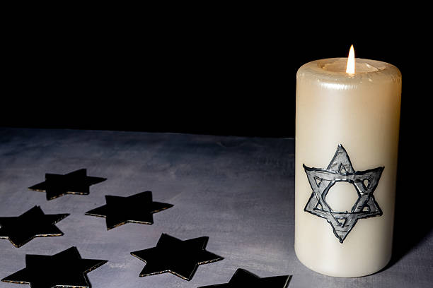 istock A white candle with a Star of David stands 2255263907