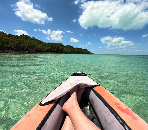 red and blue kayaks in shallow water on the island of Motu Tapu, Bora Bora