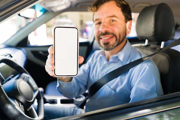 istock Rideshare driver showing mobile app with blank screen for online booking and transportation service 2255266200