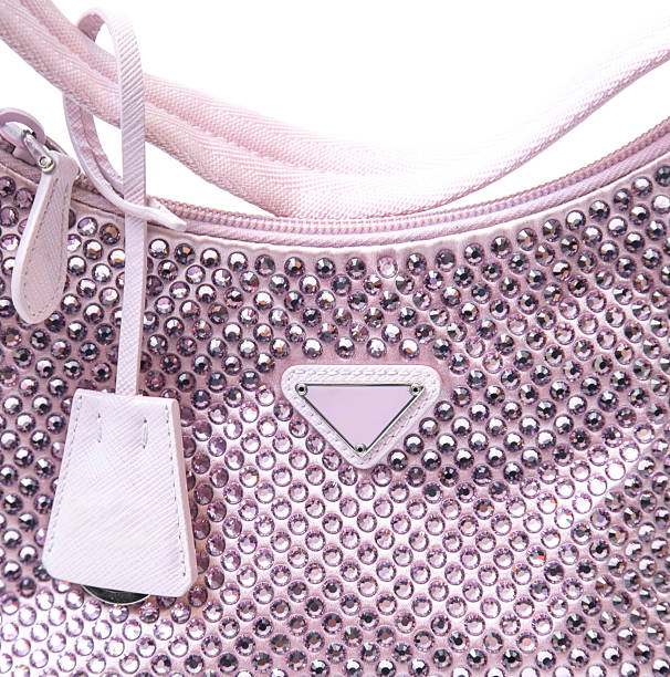Studio shot of a pink rhinestone shoulder bag displayed from front back and side view isolated on a white background featuring a sparkling crystal embellished surface short strap compact size and glamorous design suitable for womens fashion evening accessories ecommerce catalogue and luxury product presentation