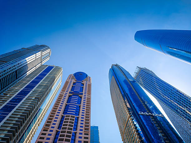 01 08 2026 - Dubai, United Arab Emirates. High skyscrapers wide angle view from below in Dubai