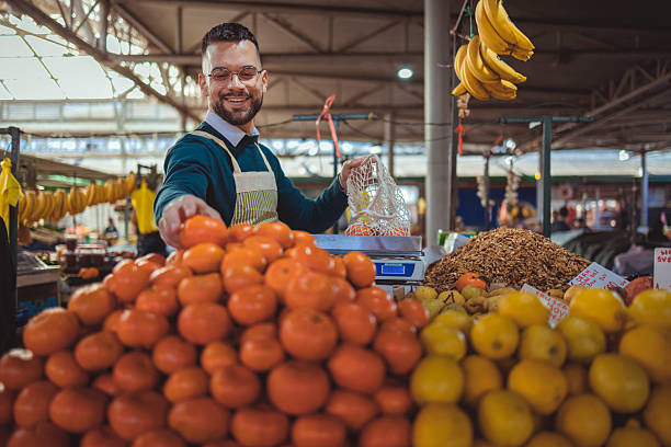 istock Farmer Selling Produce at Self Owned Market Stall 2255268974
