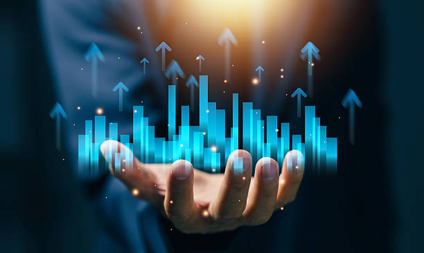 istock Business professional holding rising bar charts with upward arrows, representing data analytics, business growth, performance metrics, financial success, and strategic planning in digital economy. 2255269324