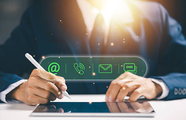 istock Businessman using tablet with digital contact icons, representing business communication, customer support, contact information, omnichannel service, and modern digital interaction strategy. 2255269330