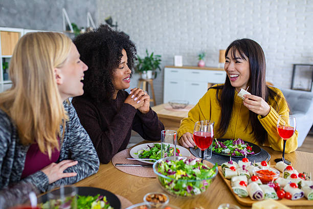 istock Female Friends Enjoying Meal and Conversation 2255276119