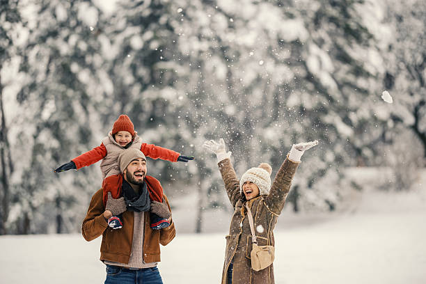 istock Family playing outdoors enjoying fresh snow day 2255277801