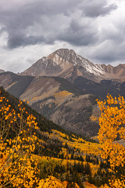 istock Beautiful Rugged Snowcapped Mountain Landscape with Autumn Trees in Foreground 2255281020