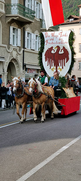 Meran, South Tyrol, Italy: 19 October 2025 - During autumn is held the grape festival in Merano, Sudtirol. Many groups from villages nearby come to celebrate. They march in groups with a marching band.