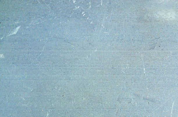 istock Close-up texture of a scratched brushed metal surface with a cool blue-grey tone 2255288387