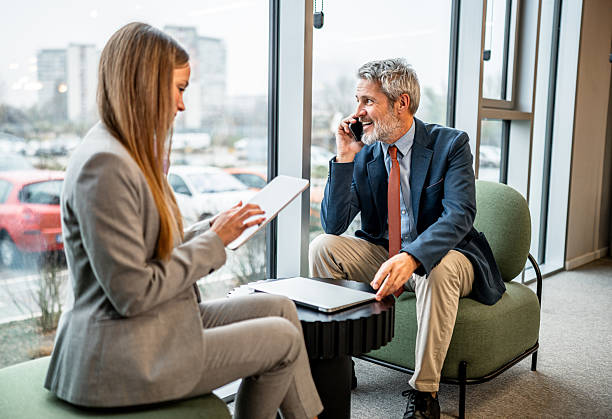 istock Business professionals collaborating in modern office lounge 2255289117