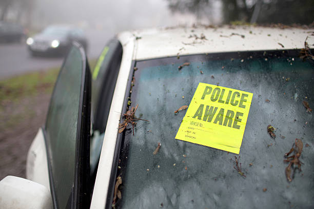 Police Aware stuck on a crashed car on a foggy winter's morning