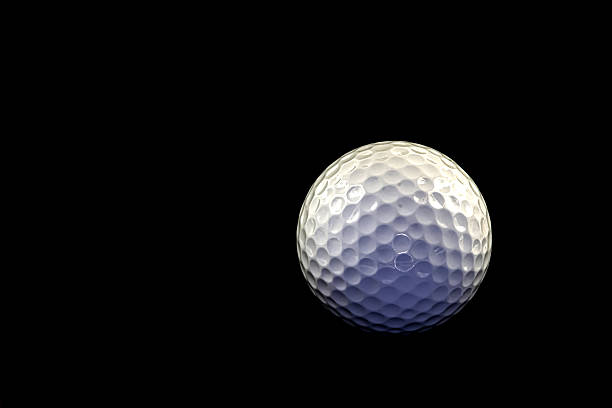 istock Close-Up of White Golf Ball on Black Background 2255295279