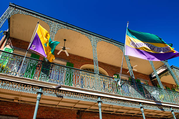 New Orleans, Louisiana in Mardi Gras Carnival Celebrations. Balconies of colorful buildings decorated with Mardi Gras beads and festive decorations in the French Quarter of New Orleans, Louisiana, a popular travel destination