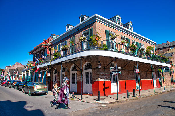 New Orleans, LA - February 9, 2016: People enjoying Mardi Gras celebrations on New Orleans streets during winter.