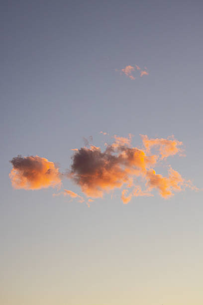 Pink, Peach and Purple Sunset Sky. One Dreamy Cloud. Copy Space.