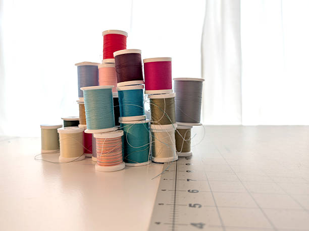 Making traditional scottish tartan textile yarn thread at dundee scotland england UK