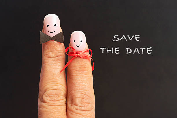 Happy loving fingers and text ,,Save the date\