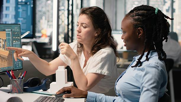 istock Professional female team working with architectural measurement software 2255306173
