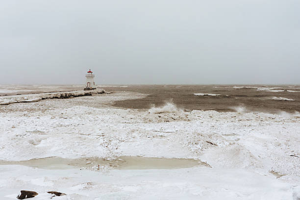 A lighthouse  along the shores of Lake Huron during a snow squall. Shot with a Canon 5D Mark IV.