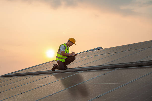 istock man in  yellow vest is working on  solar panel 2255315795