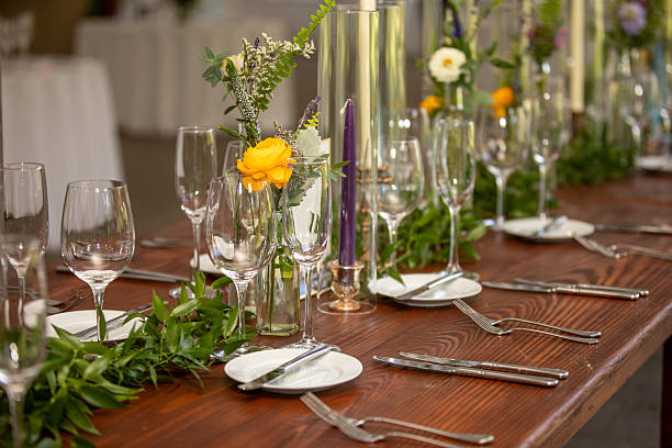 Farm table wedding reception with flowers