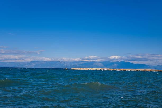 istock Blue sea and distant mountains near Koroni coast 2255317278