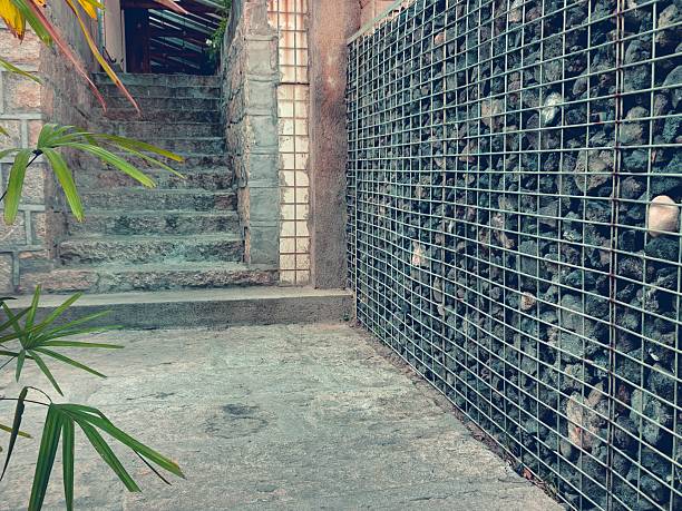 Gabion walls and greenery beside stone steps