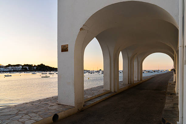 Tranquil Port d'Alguer at dawn in the small fishing village of Cadaques on the Costa Brava, Girona, Catalonia, Spain