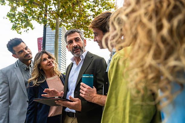 istock Business colleagues meeting outdoors discussing project details 2255340513