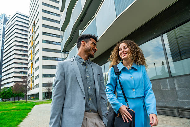 istock Diverse business professionals walking and talking in city 2255340545