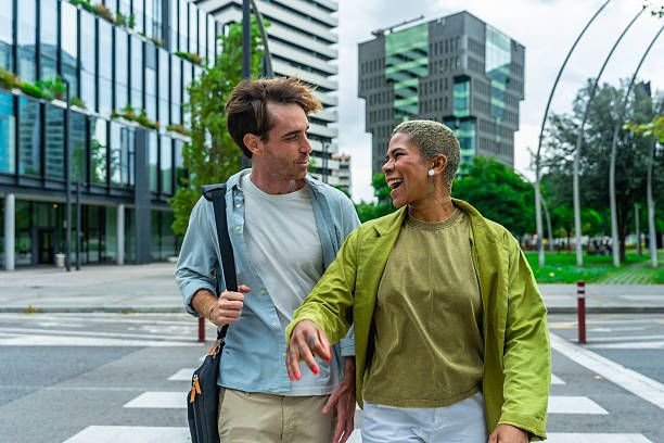 istock Diverse colleagues walking laughing on urban street 2255340690