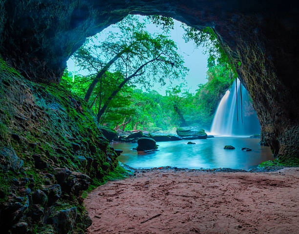 Amazing cave in deep forest with beautiful waterfalls background at Haew Suwat Waterfall in Khao Yai National Park, Thailand