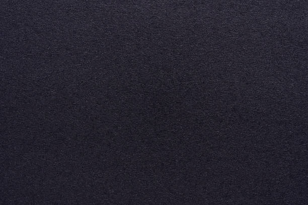 istock Dark plain black paper texture with fine grain details and matte finish 2255343433