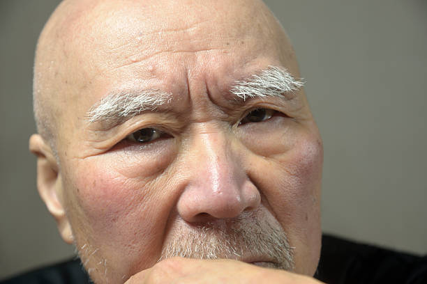 Close-up of an old man's troubled face