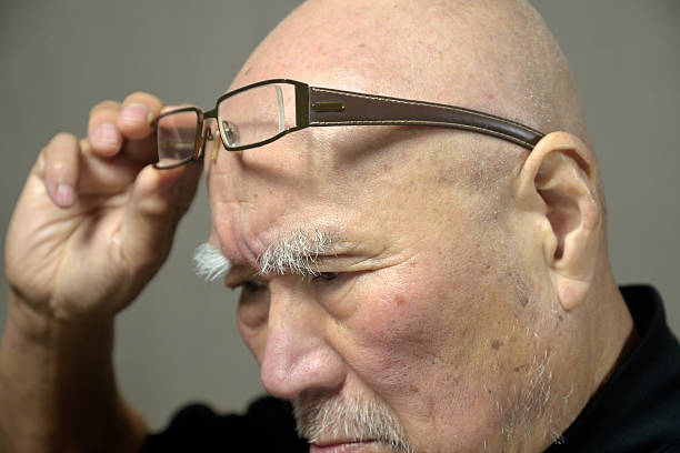 Close-up of an old man's troubled face
