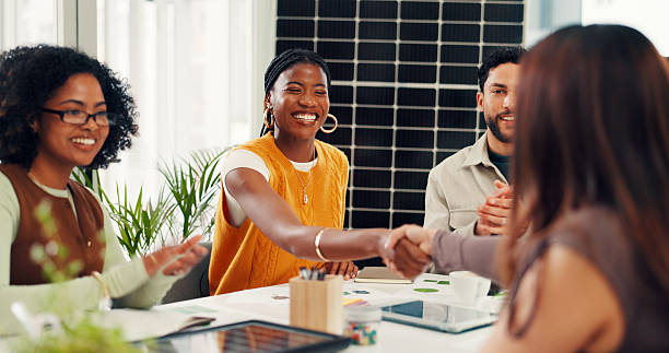 istock Solar panel, handshake or team in office with smile, clap or approval of sustainable project. Applause, meeting or investor in agency with success, agreement or deal for photovoltaic development. 2255347149