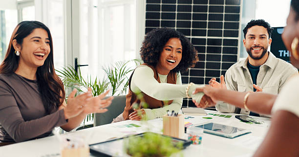 istock Solar panel, shaking hands or team in office with clap, success or approval of sustainable project. Applause, tech or investor in agency with handshake, agreement or deal for photovoltaic grid pitch. 2255347212